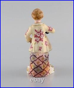 Royal Crown Derby, England. Hand-painted porcelain figure. Fruitseller. 1930s