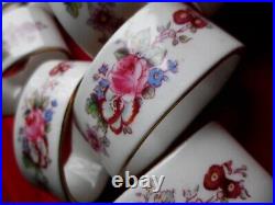 Set of 9, vintage royal crown derby porcelain napkin rings for large family